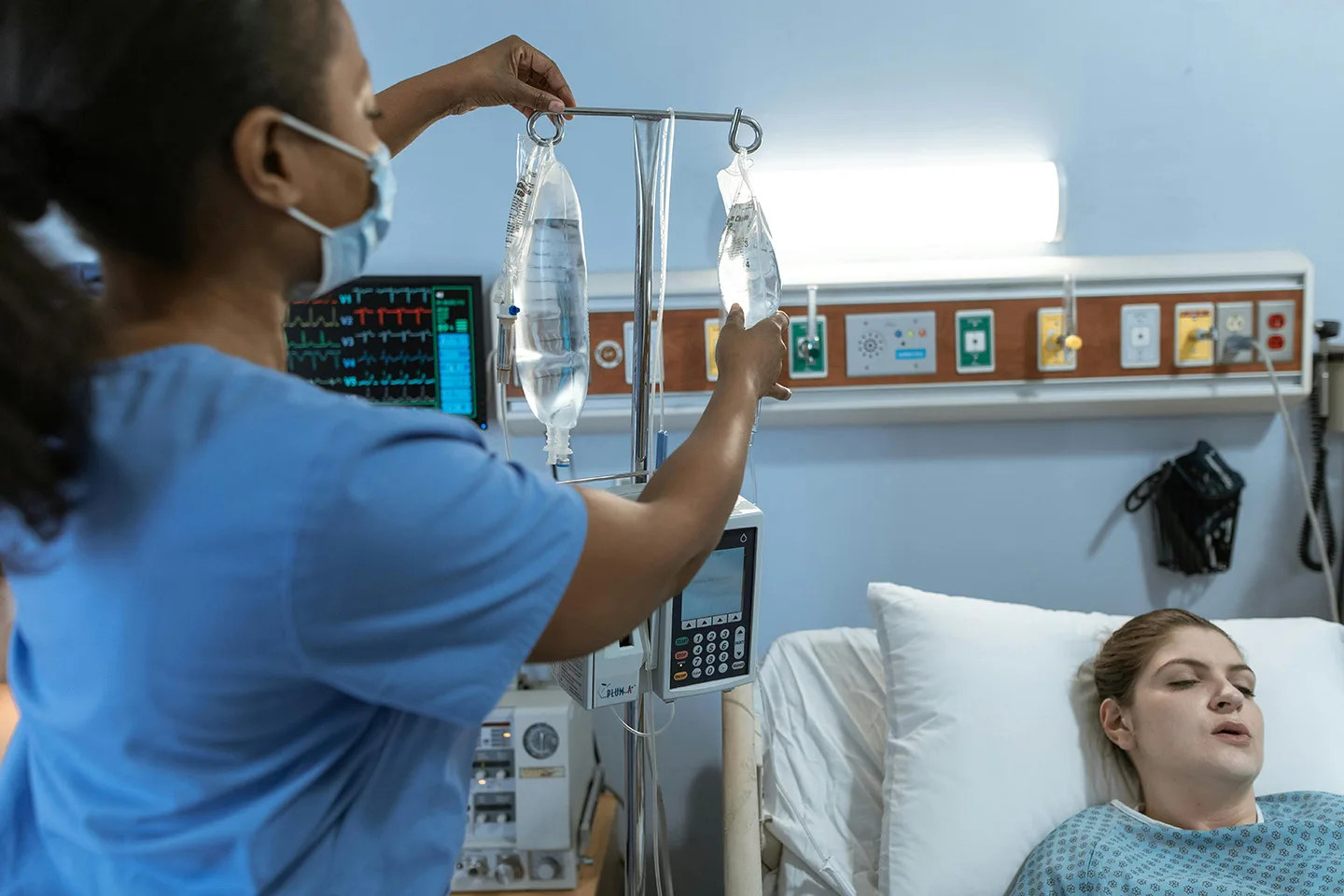 pexels-rdne-6129232 Photo by RDNE Stock project: https://www.pexels.com/photo/nurse-fixing-a-patient-s-dextrose-bags-6129232/